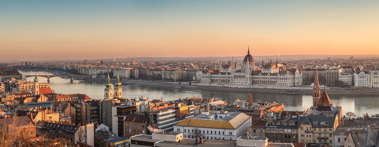 Wide Panorama of Budapest with Hungarian Parliament and Danube River at Sunrise