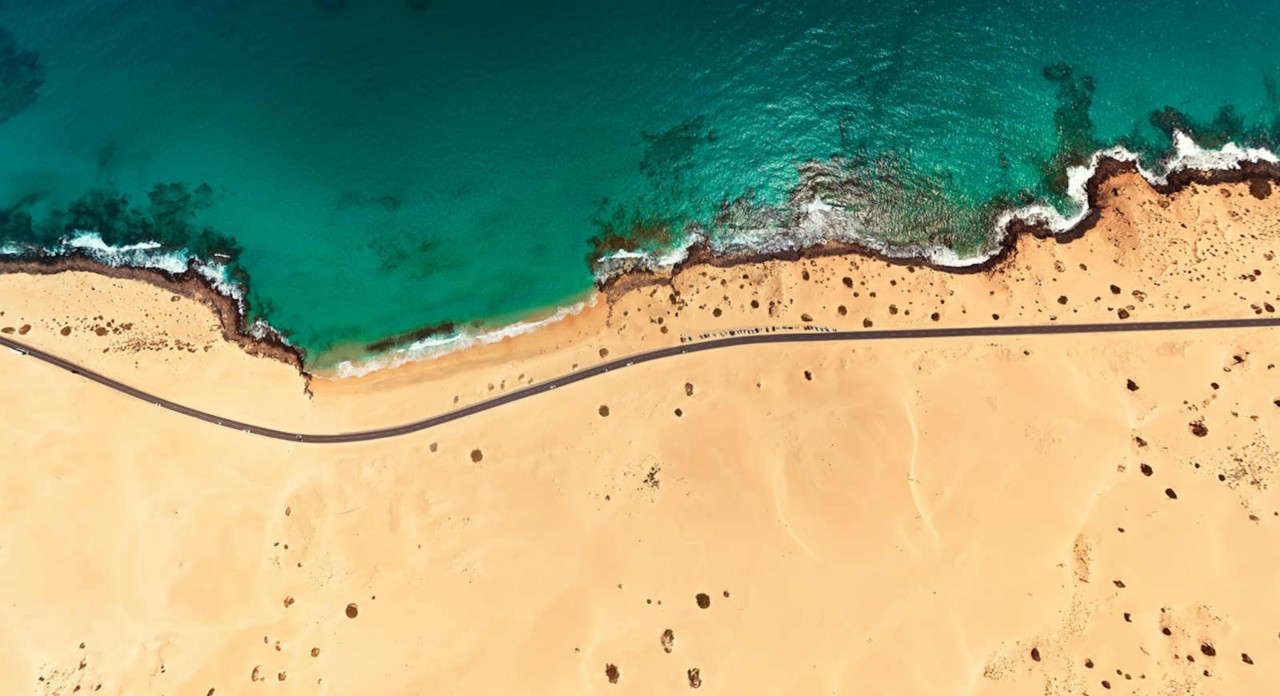 Top aerial view of Corralejo Park coast, Fuerteventura, Spain