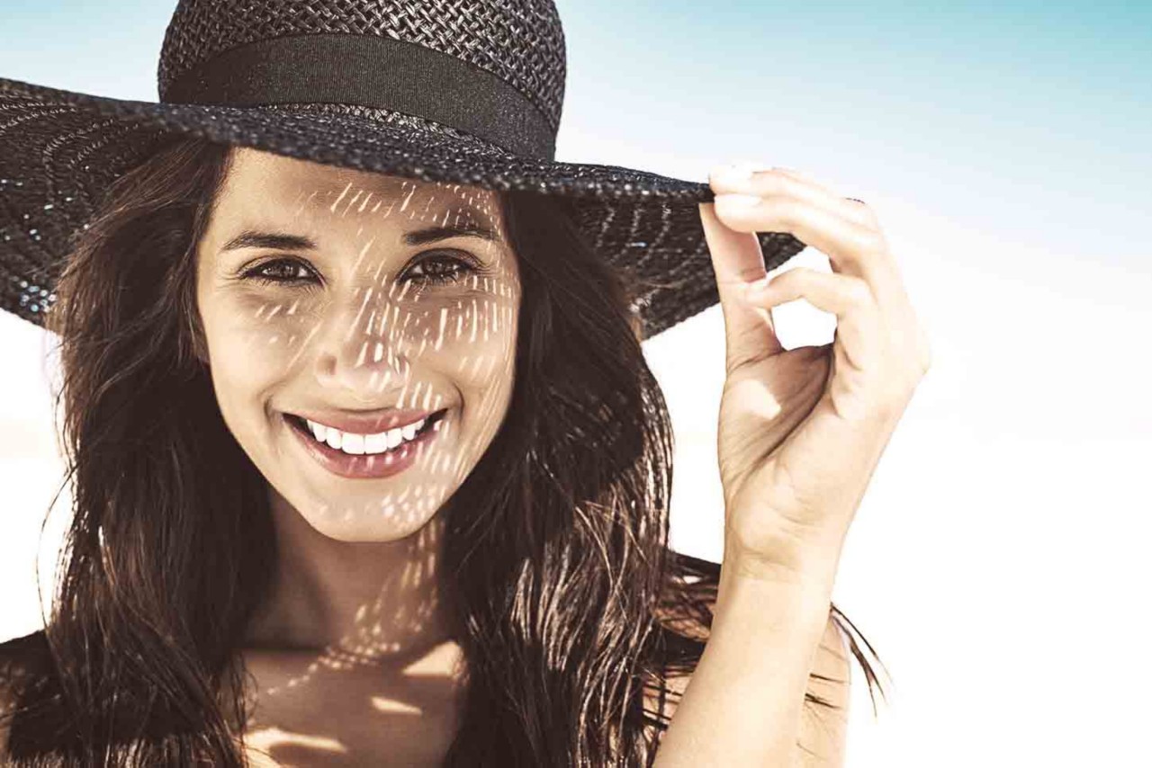 Save yourself from too much after beach hair care by wearing a hat