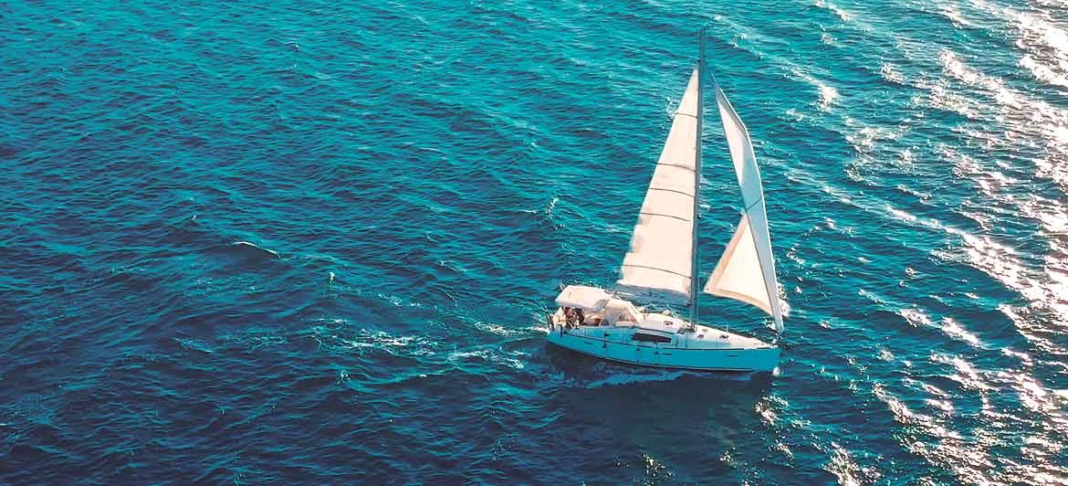 Sailing Boat on Turquoise Ocean - all inclusive holidays to the Balearic Islands