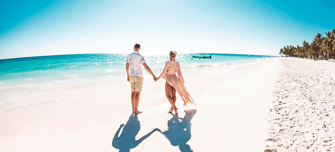 Surprise your partner with a sunset beach proposal in a tropical location