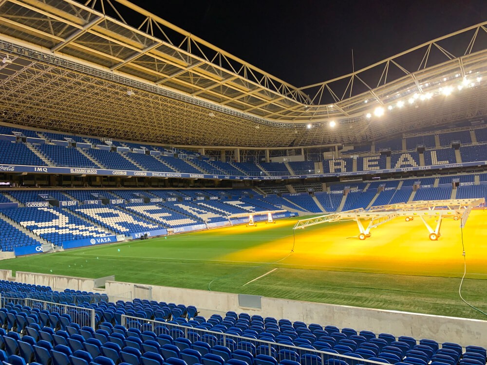 Inside the Anoeta Stadium, with blue seats spelling Reale Arena